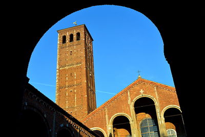 Low angle view of historic building against clear blue sky