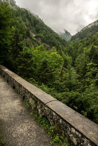 Scenic view of mountains against cloudy sky