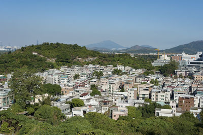 Houses in town against sky