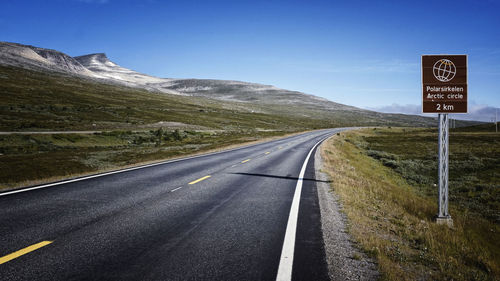 Country road leading towards mountains