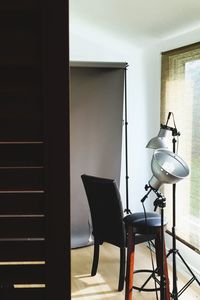 Empty chairs and table in room