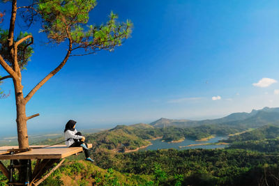 Scenic view of mountains against blue sky