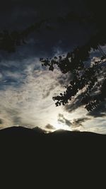 Low angle view of silhouette mountain against sky