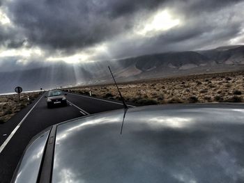 Scenic view of landscape against cloudy sky