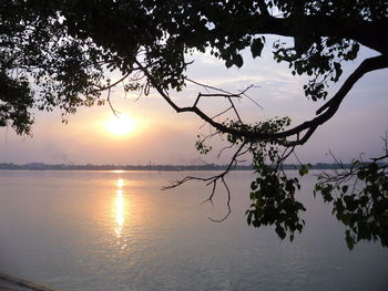 Scenic view of lake against sky during sunset