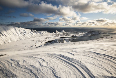 Scenic view of snowcapped mountains against sky during winter over the arctic circle in norway