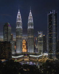 Illuminated buildings in city at night