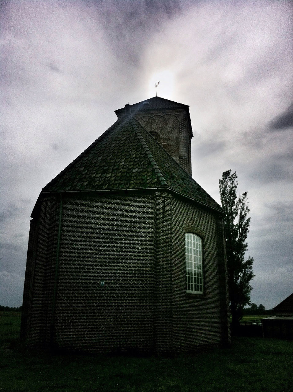 architecture, building exterior, built structure, sky, cloud - sky, low angle view, place of worship, church, cloudy, religion, spirituality, cloud, history, outdoors, day, no people, window, exterior