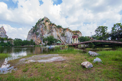 Panoramic shot of rocks by lake against sky