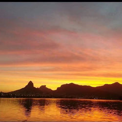 Scenic view of lake at sunset