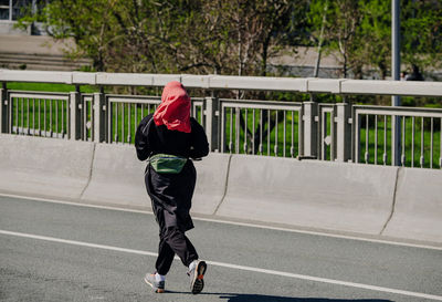 Full length of woman walking on street