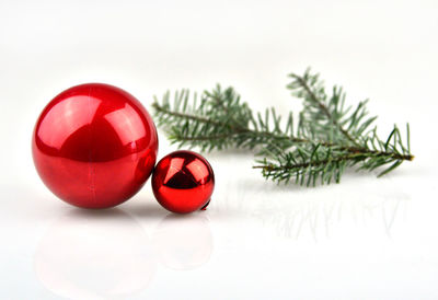 Close-up of christmas decorations over white background