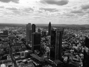 High angle view of modern buildings in city against sky