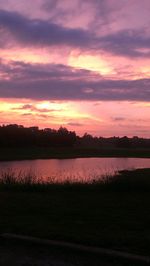 Scenic view of lake at sunset