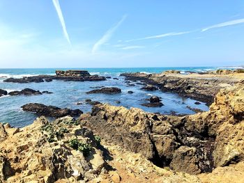 Scenic view of beach against sky