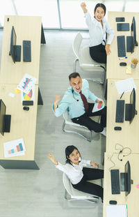 High angle view of business people sitting at office