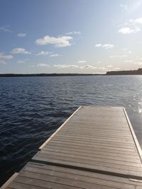 Pier over sea against sky