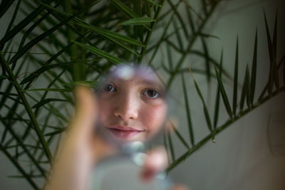 Portrait of young woman in mirror 