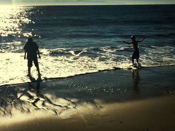 People standing on beach