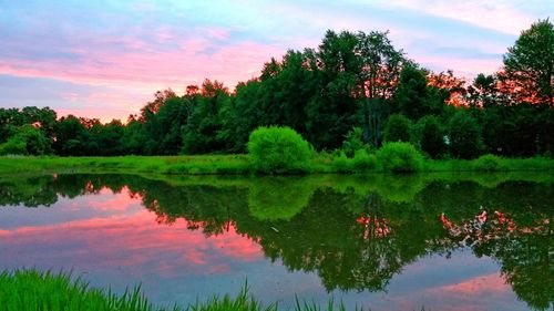 Scenic view of lake against cloudy sky