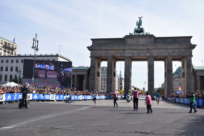 Group of people in front of historical building