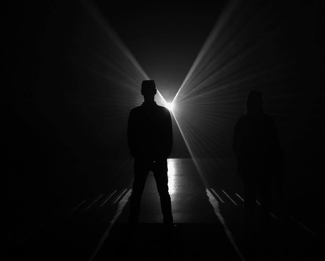silhouette, men, standing, real people, people, rear view, shadow, full length, illuminated, sunlight, lifestyles, leisure activity, light - natural phenomenon, sunbeam, architecture, indoors, group of people, dark, nature, walking, light at the end of the tunnel, nightlife