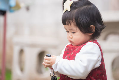 Portrait of cute girl playing outdoors