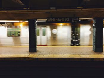 Blurred motion of train at railroad station