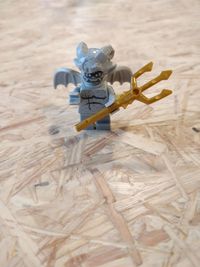 Close-up of toy figurine on wood