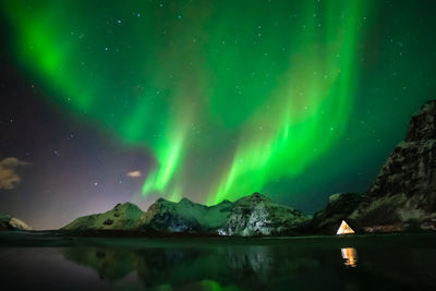 Scenic view of mountains against sky at night
