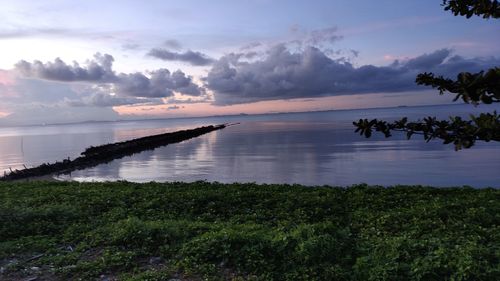 Scenic view of sea against sky during sunset