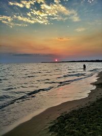 Scenic view of sea at sunset