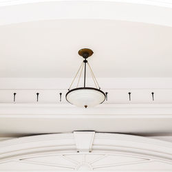 Close-up of illuminated pendant lights hanging from ceiling