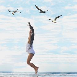 Seagulls flying over sea