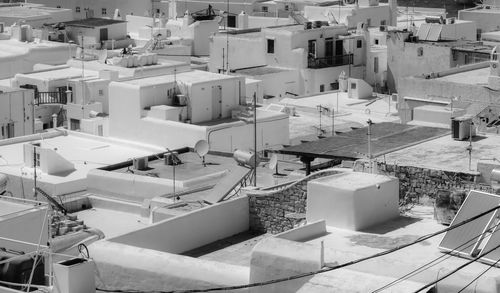 High angle view of buildings in city - mykonos view from above - top of the greek bulindings in bw