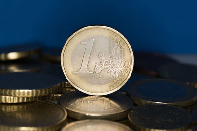 Close-up of coins against blue background