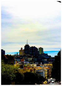 Buildings in city against sky