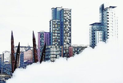 Low angle view of modern buildings against sky