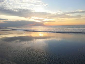 Scenic view of sea against sky at sunset