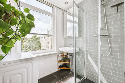 Low section of woman standing in bathroom