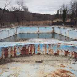 View of an empty abandoned swimming pool