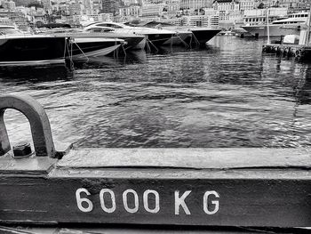 Close-up of boats moored at harbor