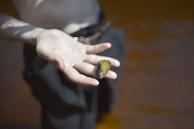 Midsection of man holding ice cream