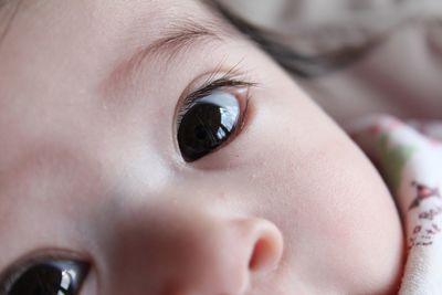 Close-up portrait of cute baby at home