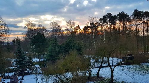 Scenic view of lake against sky during winter