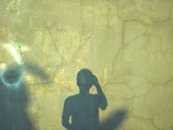 Shadow of woman on wall