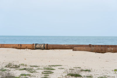 Scenic view of beach against clear sky