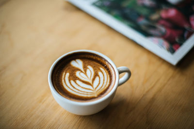 Close-up of cappuccino on table