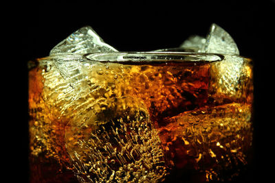 Close-up of beer on black background