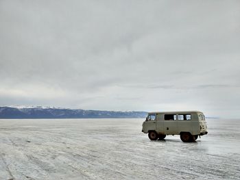 View of car on desert land